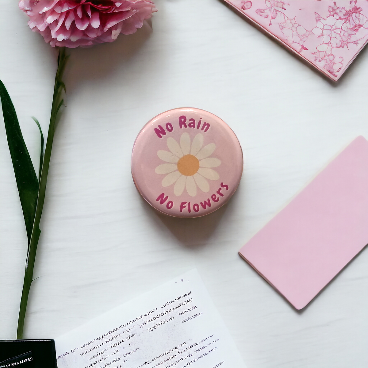 No rain no flowers metal badge