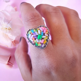 Chunky sprinkle heart ring on a wavy hammered band